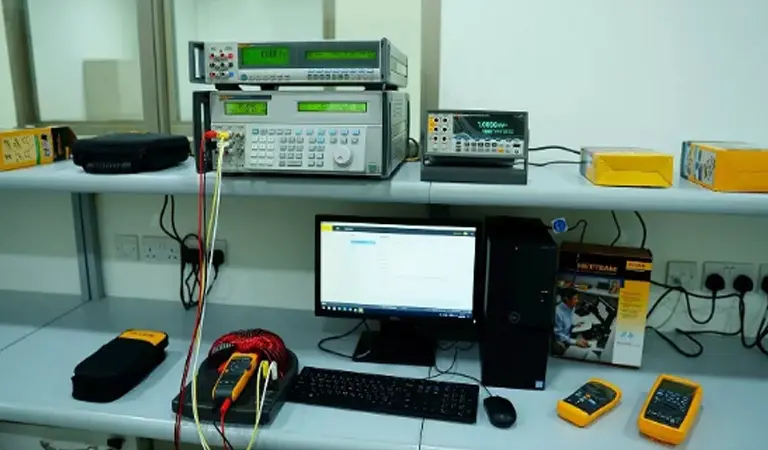 electronic calibration set up on a workbench at a calibration company in uae